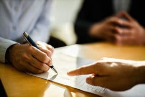 person-signing-contract
